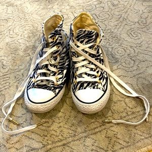 Converse, slightly fuzzy zebra print high tops. In fair condition.